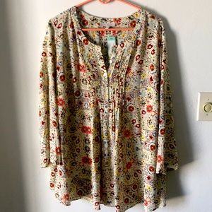 Cream and floral pattern pin tuck blouse.